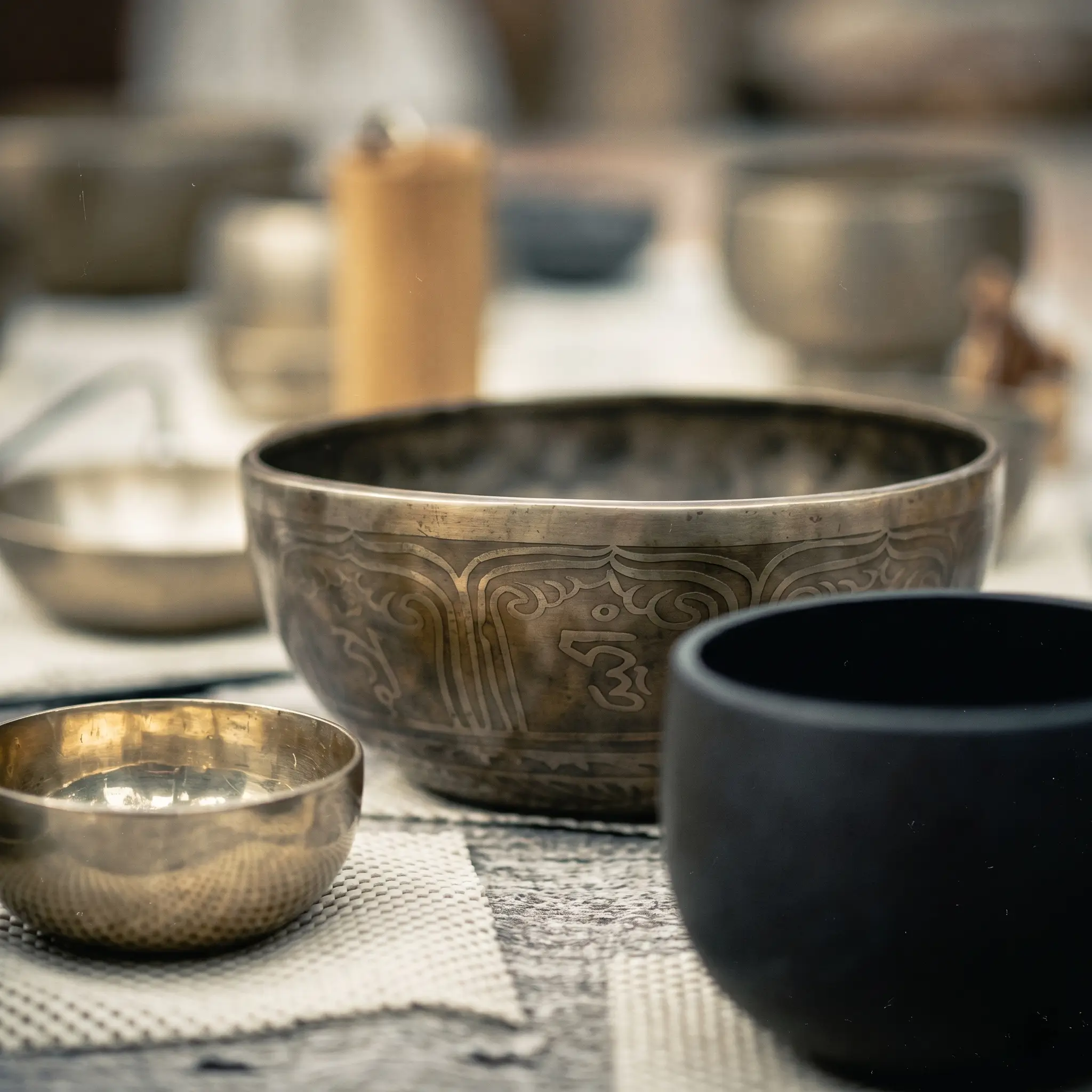 Hands cradling a warm cup of cacao on a wooden table